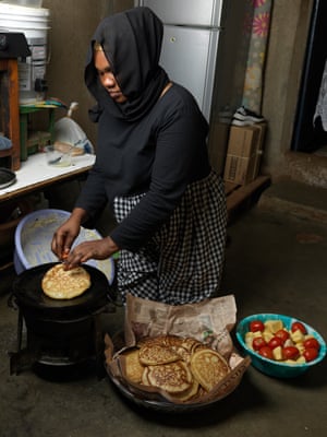 A woman prepares pancakes
