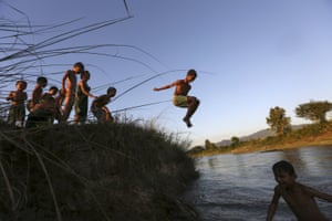 Children play in a creek in Naypyitaw, Myanmar