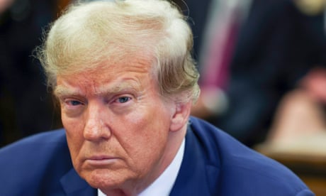Trump stares at camera.
