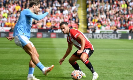 Jack Grealish takes on Sheffield United’s George Baldock at Bramall Lane.