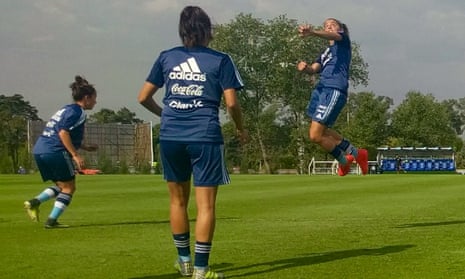 Argentina train with Mariana Larroquette jumping to head the ball as Valentina Cámara, left, and María Belén Potassa look on.