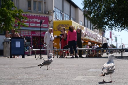Fard and Erlam stand with microphones in Clacton’s town square to drum up interest in their campaigns.