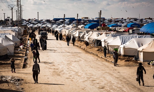 People at the al-Hawl camp in Syria, where as many as 30,000 people have arrived from Baghuz