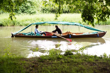 The trio hired a 130-year-old mahogany skiff.