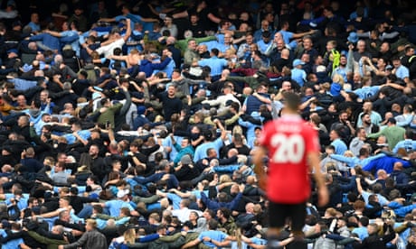 Manchester City fans celebrate Erling Haaland scoring against Manchester United on 2 October 2023.