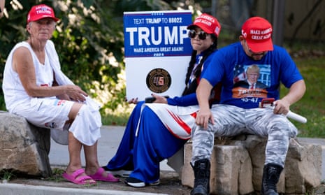 Supporters of Donald Trump rest near the Fulton county jail.