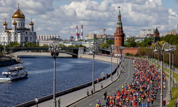 People taking part in the Moscow half marathon along the Moscow River around the Kremlin Palace in Russia on 15 May 2022.
