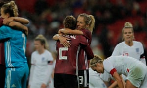 Germany’s Sophia Kleinherne and Kathrin Hendrich celebrate at the final whistle.