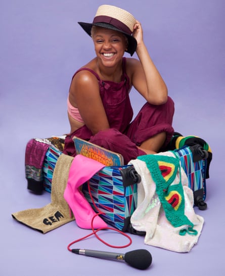 Gemma Cairney sits in a suitcase surrounded by her stuff