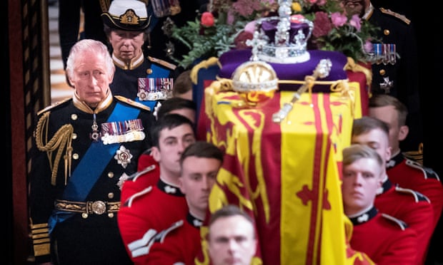 King Charles and members of the royal family follow behind the coffin of Queen Elizabeth II as it is carried out of Westminster Abbey.