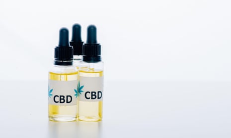 Cannabis oil in bottles with lettering CBD on white background.