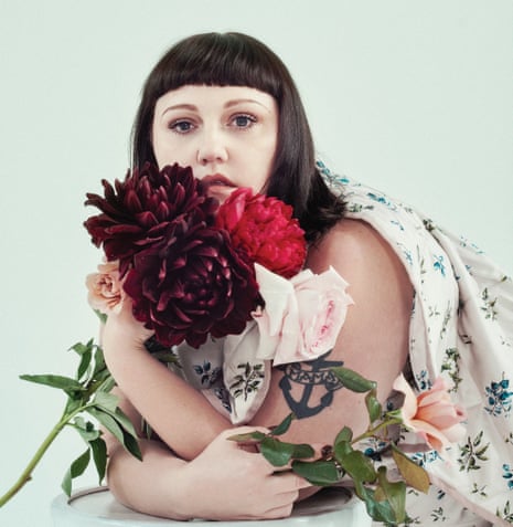 Beth Ditto holding flowers