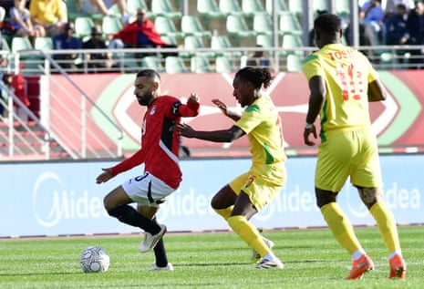 Egypt’s Mohamed Salah (left) shields the ball from Benin’s Sessi Octave D'Almeida.