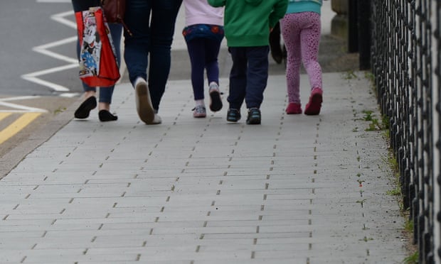 Children walking on a pavement