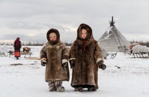 Two Nenets children keep warm on Russia’s Yamal peninsula, one of the world’s most remote and inhospitable places