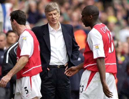 Martin Keown and Sol Campbell walk past Arsène Wenger after a costly 2-2 draw at Bolton in April 2003.