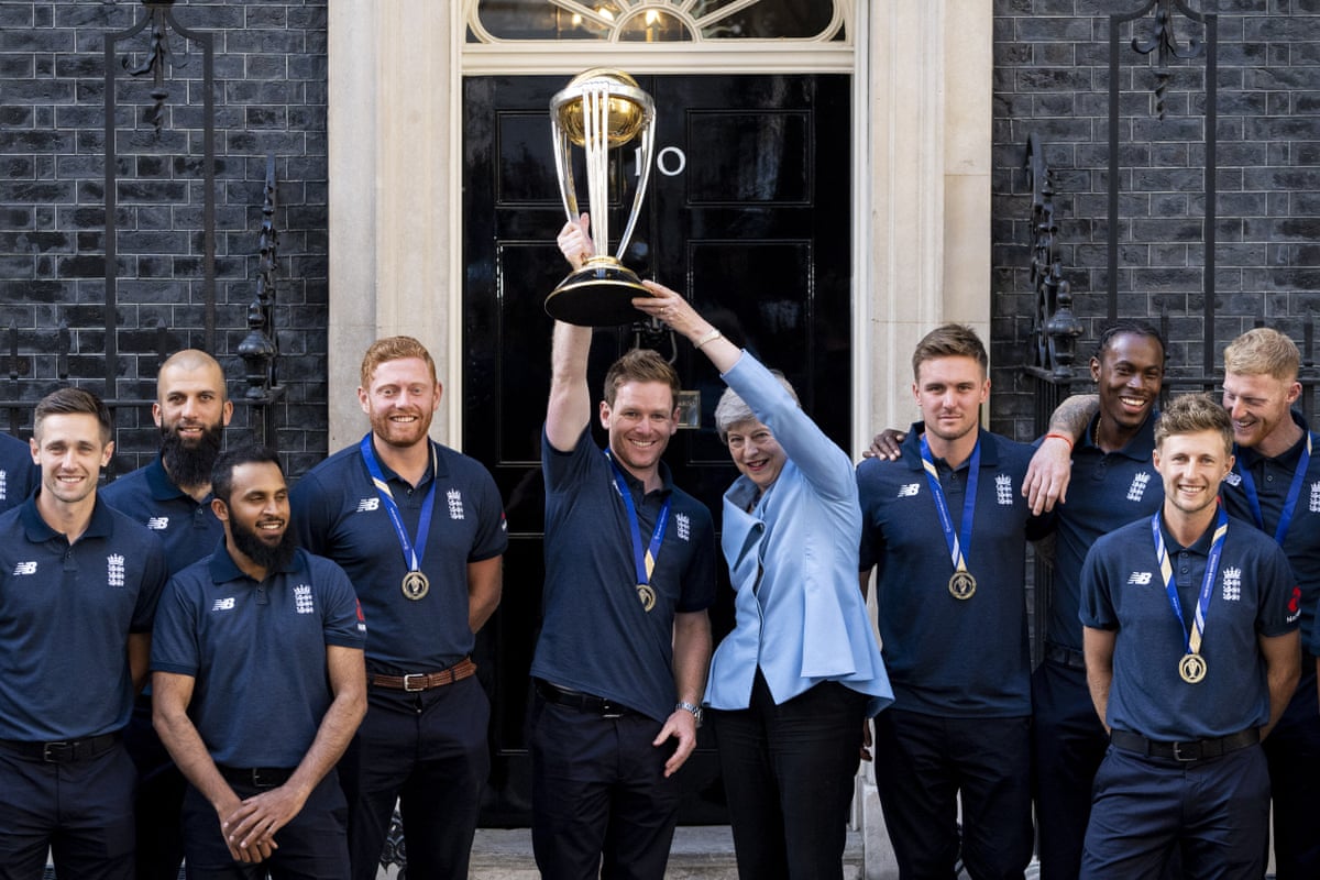 (Left to right) Chris Woakes, Moeen Ali, Adil Rashid, Jonny Bairstow, captain Eoin Morgan, prime minister Theresa May, Jason Roy, Jofra Archer, Joe Root and Ben Stokes pose for a photograph outside 10 Downing Street