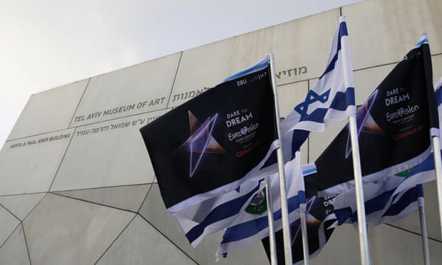 Israeli flags and flags bearing the logo of the 2019 Eurovision song contest flutter outside the Tel Aviv Museum of Art during the Eurovision semi-final allocation draw on 28 January 2019.