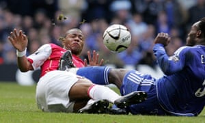 Julio Baptista is kicked in the chest by Michael Essien.