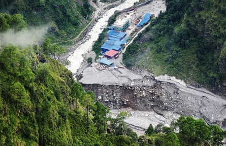 A concrete mixer trucks damaged and half-buried in mud following flash floods at the Upper Trishuli-1 (UT-1) Hydropower Plant construction site in Nepal’s Rasuwa district