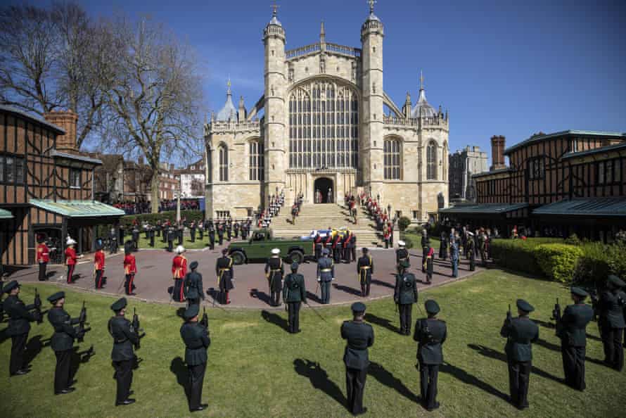 The coffin is taken from the Landrover hearse during the procession ahead of Prince Philip’s funeral at St George’s chapel in Windsor Castle.