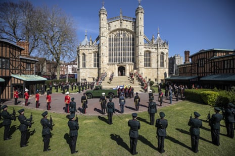 The coffin is taken from the Landrover hearse during the procession ahead of Prince Philip’s funeral at St George’s chapel in Windsor Castle.