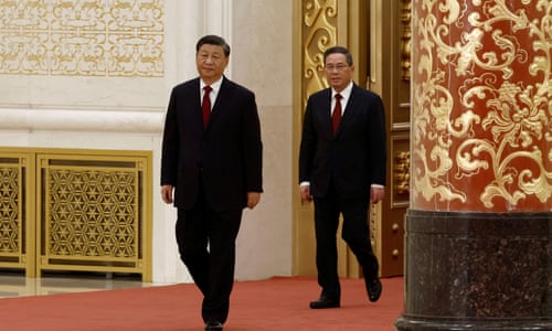 Li Qiang walks out behind Xi Jinping to meet the media following the 20th National Congress of the Communist party of China, at the Great Hall of the People in Beijing, China