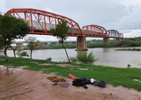 Clothes are seen on the ground of the shore of the Rio Grande river between the U.S. and Mexico after some migrants died and others were rescued as they tried to cross the rain-swollen Rio Grande river into the United States near Eagle Pass, Texas, U.S., in Piedras Negras, Mexico, September 3, 2022. REUTERS/Carlos Garcia NO RESALES. NO ARCHIVES