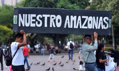People hold a mock coffin with the words ‘Our Amazon’ in a demonstration during the youth global climate strike in Cali, Colombia, in September 2019. 