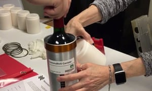 Company researchers prepared bottles of French red wine to be transported to the International Space Station in November 2019