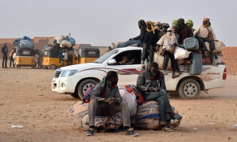 West African migrants in Agadez, Niger, wait to be taken away in the hope of a new life in north Africa or Europe.