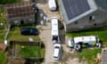 View from above of farm with police vans