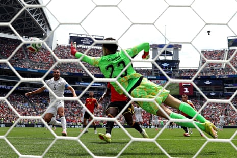 One for the camera. Mostafa Shoubir makes a fine stop to deny Belgium