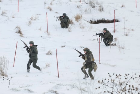 Ukrainian servicemen attend mock anti-sabotage drills near the border with Russia in the Sumy region.