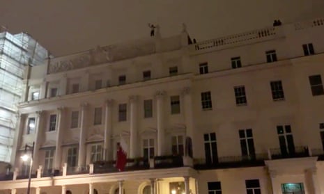 A man is seen on the roof of Bahrain's Embassy in London, Britain, July 26, 2019 in this still picture obtained from social media video by Reuters on July 27, 2019. Twitter/Sayed Ahmed AlWadaei/via REUTERS  THIS IMAGE HAS BEEN SUPPLIED BY A THIRD PARTY. MANDATORY CREDIT. NO RESALES. NO ARCHIVES.
