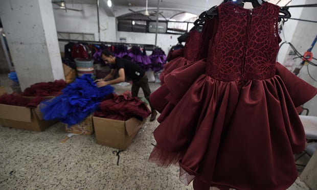 Dresses are seen at a textile factory near Kerem Shalom the commercial border crossing with Israel to the east of Rafah in the south of the Gaza Strip