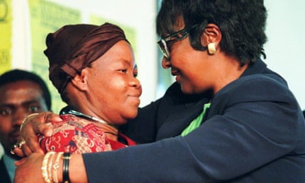 Winnie Mandikizela-Mandela (right) hugs Joyce Seipei, the mother of a murdered teenage activist, at a truth and reconciliation commission hearing in Johannesburg in 1997