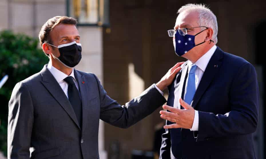 French president Emmanuel Macron greets Australian prime minister Scott Morrison in Paris in June