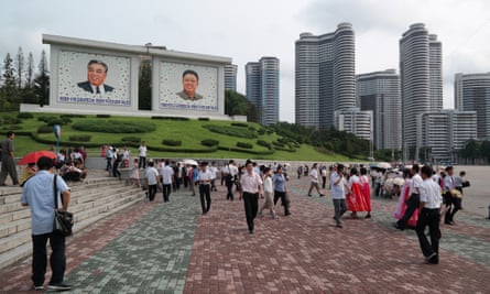 More giant portraits of the Kims, below the Changjon Street apartments – nicknamed Pyonghattan by foreign diplomats – which were completed last year in less than 12 months.