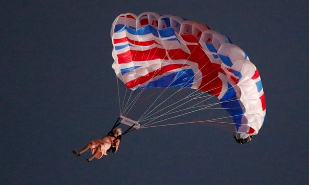 A performer playing the role of the Queen parachutes from a helicopter during the opening ceremony of London 2012.