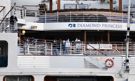 Crew members prepare to disembark the Diamond Princess in Yokohama
