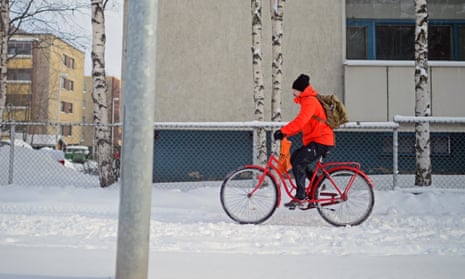 A cyclist in Rovaniemi, Finland – a city which is six miles south of the Arctic Circle.