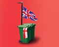 Wheelie bin and lamp-post with Saint George flag and union flag.