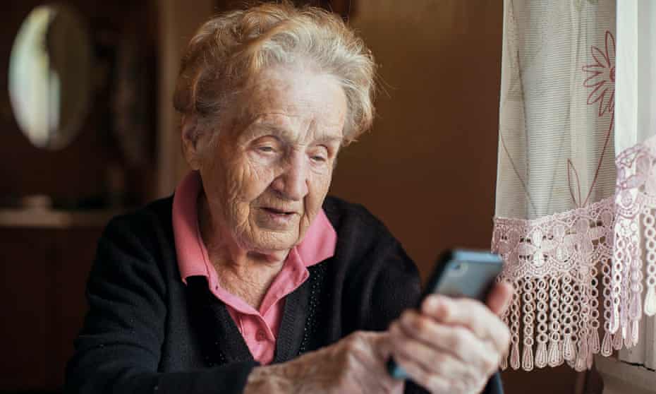 An elderly woman uses a smart phone. The coronavirus crisis has made older people find new ways to connect.