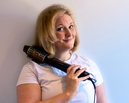 Writer Lise Smith holding a BaByliss hot brush.