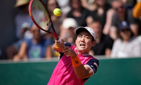 Yoshihito Nishioka plays a shot against Jeffrey John Wolf during their first round match of the 2023 French Open.