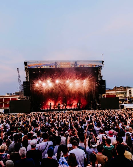 crowds enjoying a festival stage performance