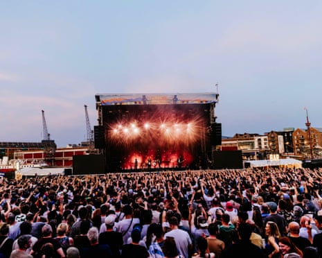 crowds enjoying a festival stage performance