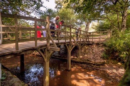 Game on … visitors at Pooh Sticks bridge.