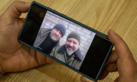 Picture of Serhi Pantiuk and Borys Humenyuk on phone